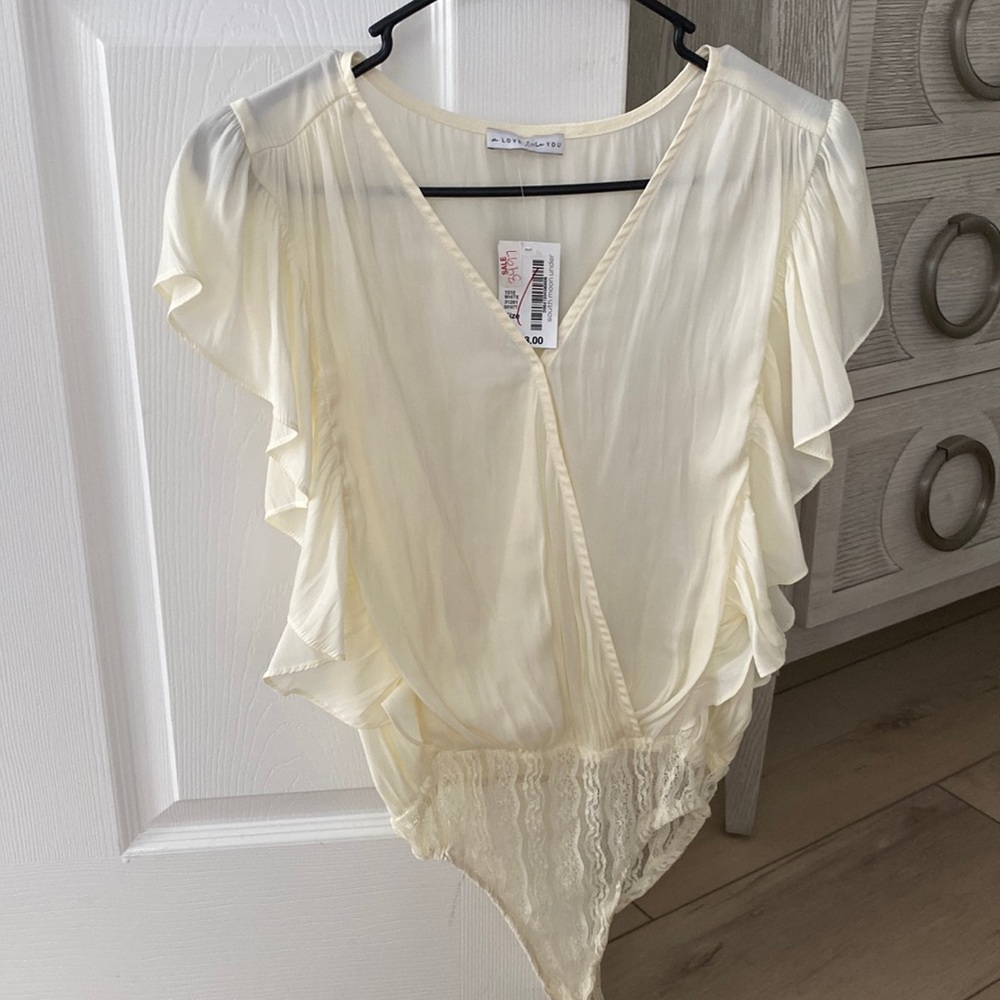 Cream silk bodysuit with ruffle sleeve